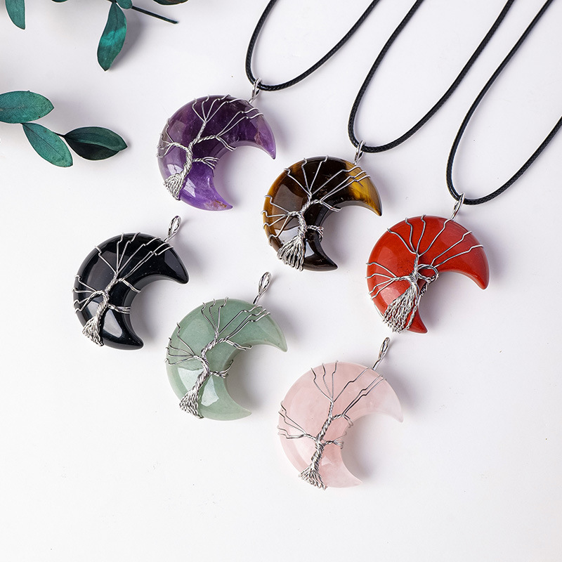 2. LAOTLON Quartz Crystal Moon Tree of Life Healing Necklace — $4.99