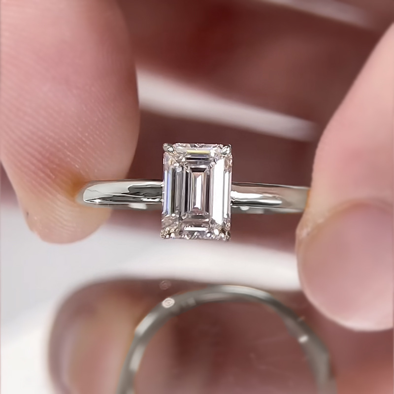 Emerald Cut Solitaire Ring In Yellow Gold With Basket Design