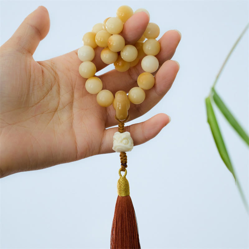 LAOTLON Natural Bodhi Seed Ivory Fruit Dancing Lion Charm Harmony Tassel Wrist Mala